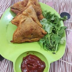 A picture of Wheat flour potato stuffed samosas.