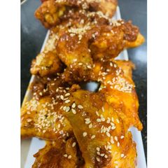 A picture of Tangy Buffalo chicken wings.