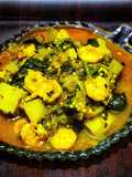 Poi chingudi curry (Prawns cooked with basella and vegetables)