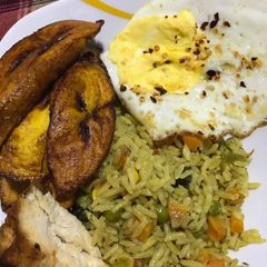 A picture of Fried rice with plantain.