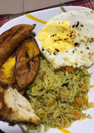 A picture of Fried rice with plantain.