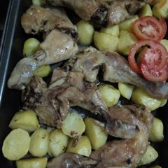 A picture of Oven roast chicken and potatoes.