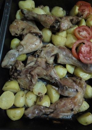 A picture of Oven roast chicken and potatoes.