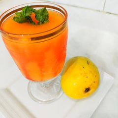 A picture of Mango juice with roohafzah.