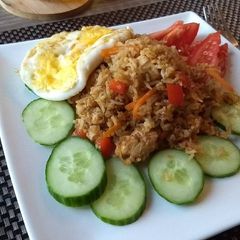 A picture of Indonesian Nasi Goreng (Fried Rice) with chicken.