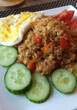 A picture of Indonesian Nasi Goreng (Fried Rice) with chicken.