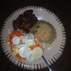 A picture of Jellop rice & spaghetti with vegetables & meat.