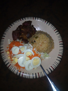 A picture of Jellop rice & spaghetti with vegetables & meat.