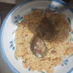 A picture of Jollof rice with fish.