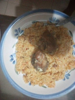 A picture of Jollof rice with fish.
