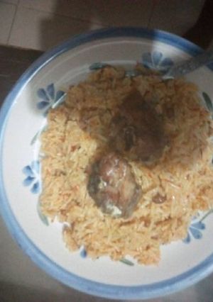 A picture of Jollof rice with fish.