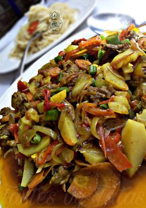 A picture of Shredded beef,Irish and veggies sauce.