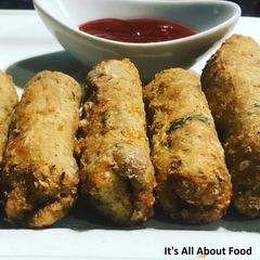 A picture of Cheesy Chicken Cigars.