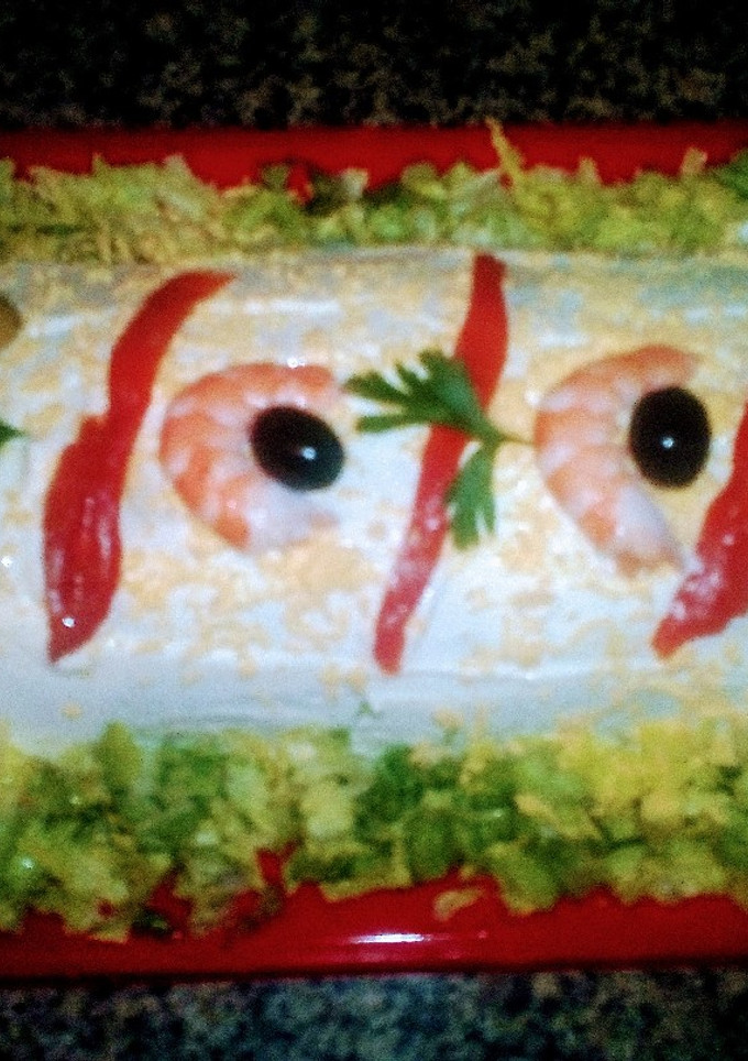 Una foto de Brazo gitano de patatas, atún y palitos de cangrejo