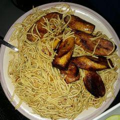 A picture of Spaghetti with fried plantain.