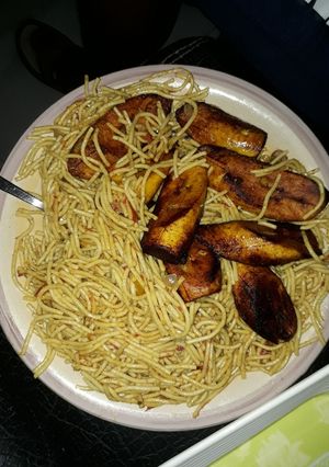 A picture of Spaghetti with fried plantain.