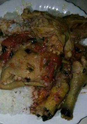 A picture of Kuku stew with plain rice.