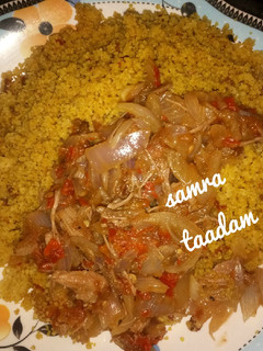 A picture of Couscous with onion sauce.