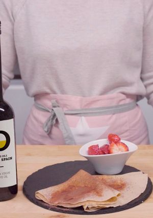 A picture of Crepes with spiced strawberries.