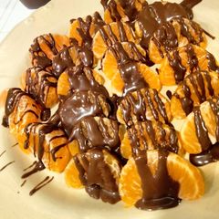 A picture of Chocolate coated Orange Slices 🍊🍫🧡.