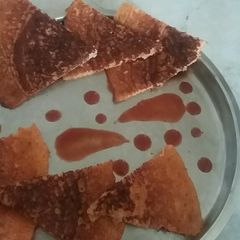 A picture of Tomato uttapam.