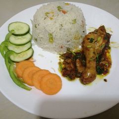Fried chicken with vegetable rice A picture of Fried chicken with vegetable rice.