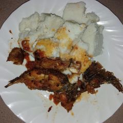A picture of Tilapia fish and ugali.