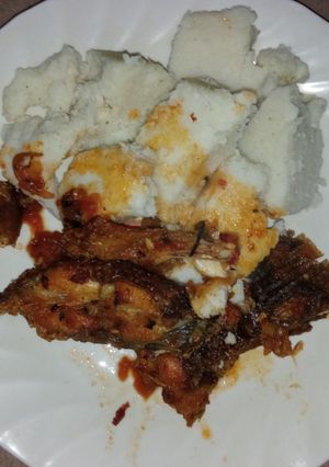 A picture of Tilapia fish and ugali.