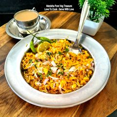 A picture of Bhutta Poha - Corn Poha - Classic Indian Monsoon Breakfast.