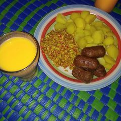 A picture of Boiled potatoes served with egg sauce and meat bars &Shashkabash.