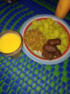 A picture of Boiled potatoes served with egg sauce and meat bars &Shashkabash.