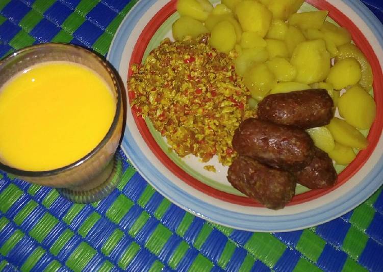 Boiled potatoes served with egg sauce and meat bars &amp;Shashkabash