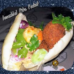 A picture of Falafel Sandwich In Pita Bread.