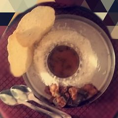 A picture of Rasam rice with tawa baaji.