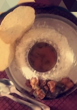 A picture of Rasam rice with tawa baaji.