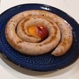 Salchicha de Cerdo con Nectarina pochada en reducción de Vino Blanco y Caldo Vegetal