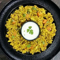 A picture of Foxtail Millet Khichdi with Moong Sprouts/Soya Chunks and mixed vegetables.