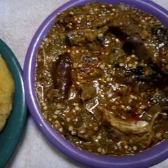 A picture of Garri pie and okro soup.