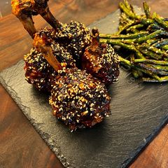 A picture of Sticky Asian Chicken Lollipops.
