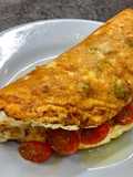 Cheddar, Broccoli and Red Chilli Soufflé Omelette, Garlic roasted Cherry Plum Tomatoes, Olive Oil