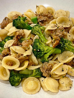 A picture of Orecchiette pasta with sweet sausage and broccoli.
