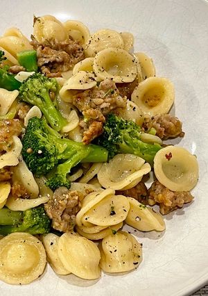 A picture of Orecchiette pasta with sweet sausage and broccoli.