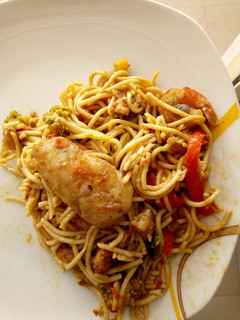 A picture of Pasta with chicken breast tomato sauce.