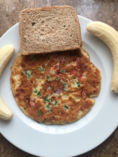 A picture of Breakfast cheese omelette # banana and bread.