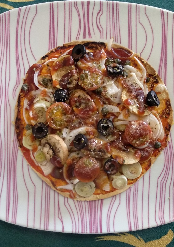 Una foto de Mini pizza en tortilla de trigo