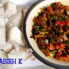 A picture of Boiled yam and ugba and ugu sauce.