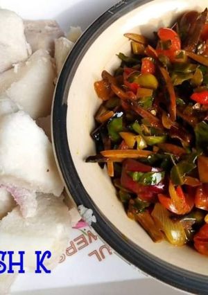 A picture of Boiled yam and ugba and ugu sauce.