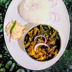 A picture of Fish head, Veggies Malabar Spinach Curry.