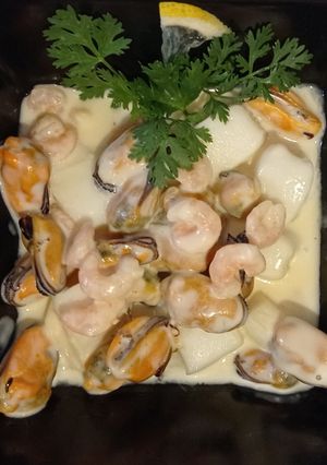 Фото Морепродукти в сирному соусі.
