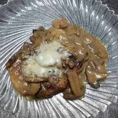 A picture of Mushroom marsala pork chops.